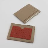 Mitta mini leather wallet with a perforated card pocket on one side and 3 card pockets and a compartment on the other side. Beige-strawberry color combination. With a zippered compartment for small items.