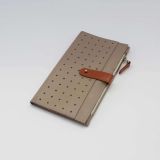 Mitta women's leather long wallet from the back. With a perforated pocket on the back. Beige-orange color
